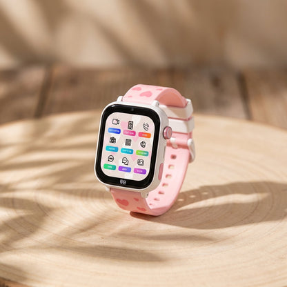 Close-up of Kidi Watch Kidi Day 4G on wooden surface, highlighting its colorful touch screen and sleek design with soft lighting.